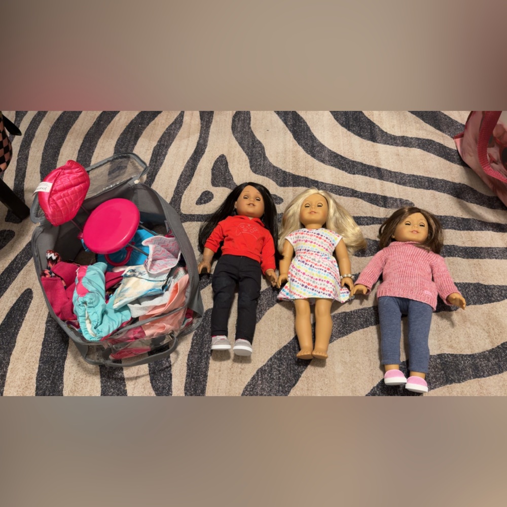 American Girl Doll Trio with Red, Black, and Pink Outfits